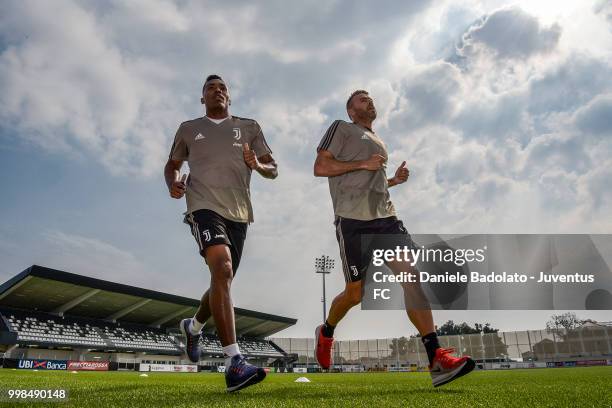 Alex Sandro and Andrea Barzagli during a Juventus morning training session on July 14, 2018 in Turin, Italy.