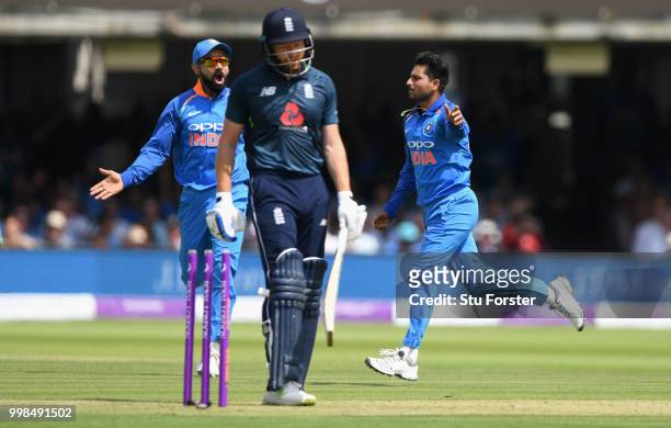England batsman Jonathan Bairstow is bowled by India bowler Kuldeep Yadav as he celebrates with Virat Kohli during the 2nd ODI Royal London One Day...