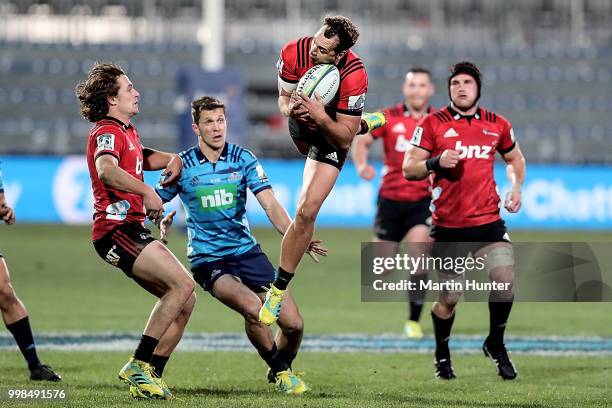 Israel Dagg of the Crusaders controls the ball during the round 19 Super Rugby match between the Crusaders and the Blues at AMI Stadium on July 14,...