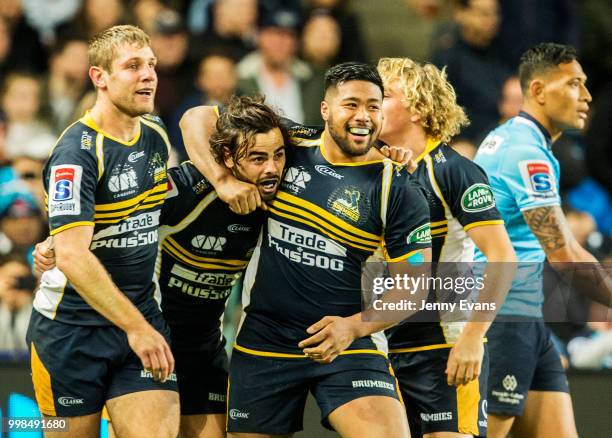 Andy Muirhead of the Brumbies is congratulated by team mates after a try during the round 19 Super Rugby match between the Waratahs and the Brumbies...