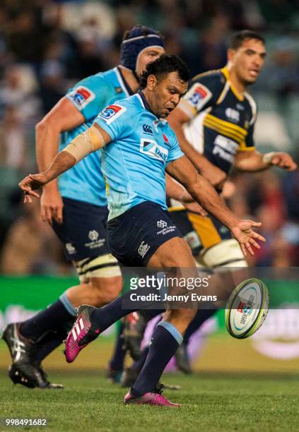 Kurtley Beale of the Waratahs kicks the ball during the round 19 Super Rugby match between the Waratahs and the Brumbies at Allianz Stadium on July...