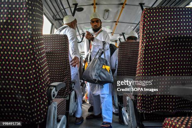 Kashmiri Muslim pilgrim boards the bus as he leaves for the annual hajj pilgrimage to the holy city of Mecca, in Srinagar, Indian administered...