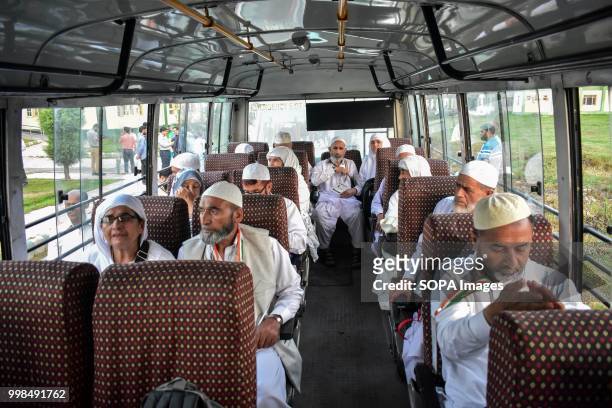 Kashmiri Muslim pilgrims wait in a bus before their departure for the annual Hajj pilgrimage in Srinagar, Indian administered Kashmir. The first...