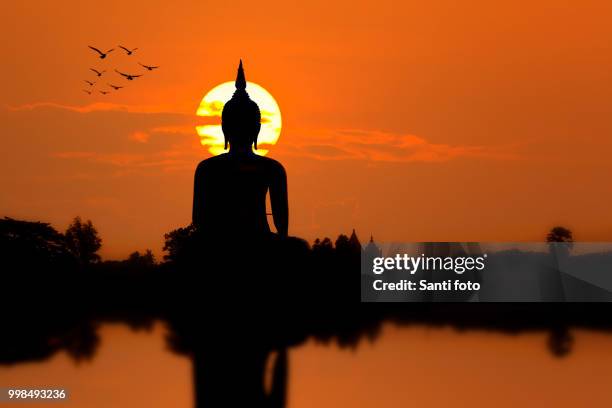 silhouette big buddha statue - sanyi stock pictures, royalty-free photos & images