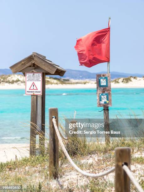 red flag on ses illetes - ses stock pictures, royalty-free photos & images