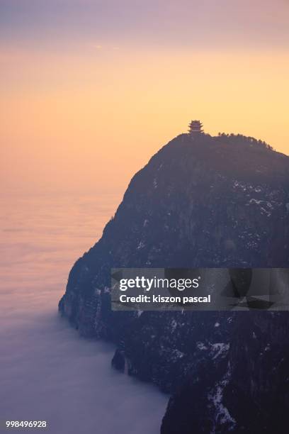 temple at the top of the emeishan mountain with seacloud during sunset , sichuan province , china - emei shan stock pictures, royalty-free photos & images