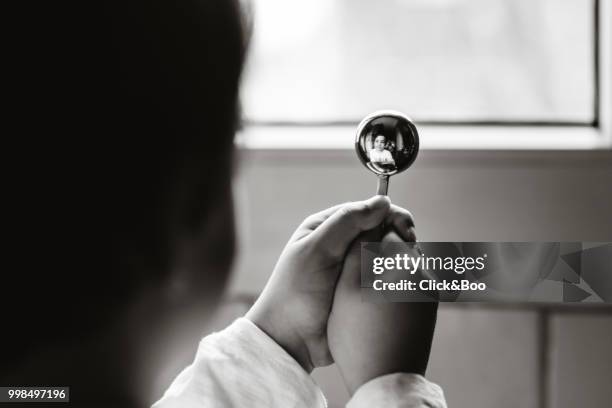 little boy reflection while holding a spoon - click&boo bildbanksfoton och bilder
