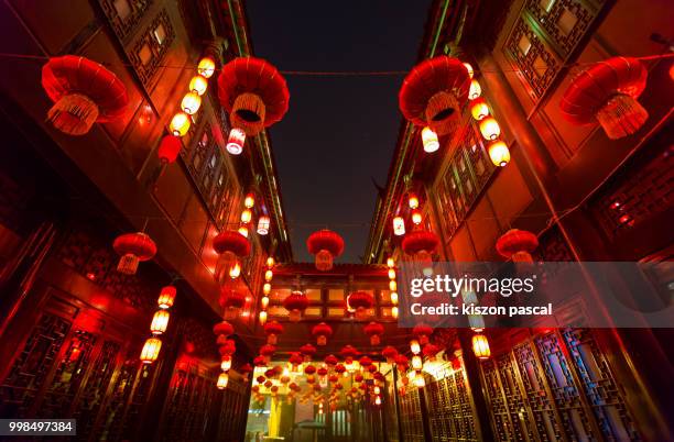 the traditional red lantern in a street of chengdu in sichuan during a chinese new year . china - chinese lantern night stock pictures, royalty-free photos & images