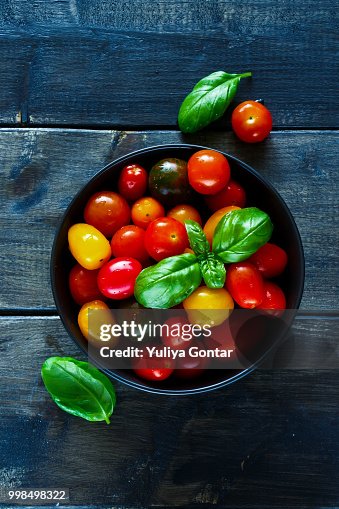 Tomatoes in black bowl Tomatoes in black bowl