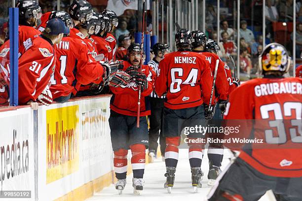 Dale Mitchell of the Windsor Spitfires celebrates his first-period goal against the Calgary Hitmen with teammates during the 2010 Mastercard Memorial...