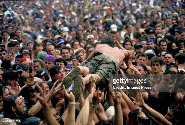 Man crowd surfs during Woodstock circa 1994 in Saugerties.