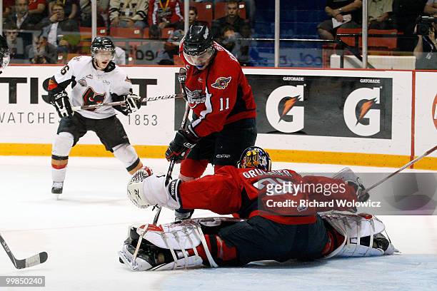 Philipp Grubauer of the Windsor Spitfires stops the puck on a shot from Cody Sylvester of the Calgary Hitmen during the 2010 Mastercard Memorial Cup...
