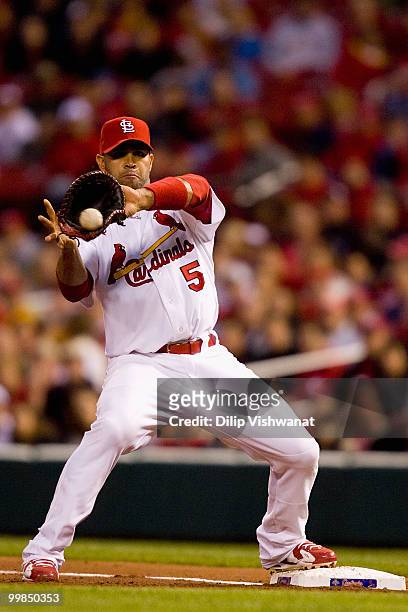 Albert Pujols of the St. Louis Cardinals fields a throw to first base against the Washington Nationals at Busch Stadium on May 17, 2010 in St. Louis,...