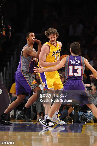 Pau Gasol of the Los Angeles Lakers makes a move in the post against Channing Frye and Steve Nash of the Phoenix Suns in Game One of the Western...