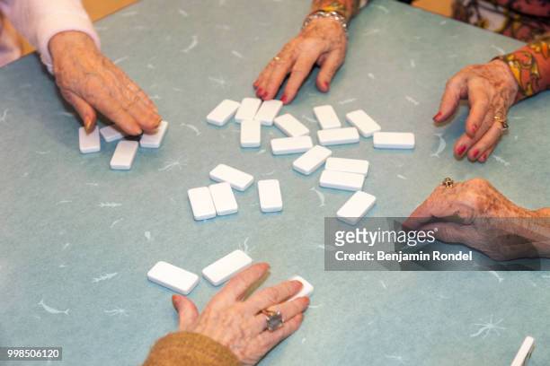 game of dominoes - benjamin rondel stock pictures, royalty-free photos & images