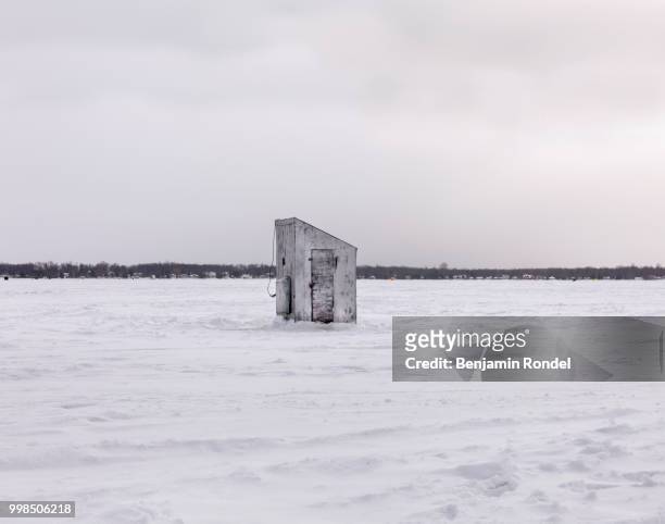 ice fishing huts - benjamin rondel stock pictures, royalty-free photos & images