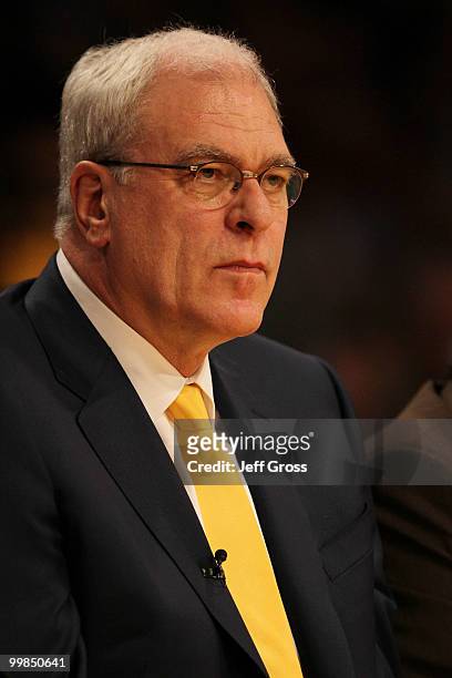 Head coach Phil Jackson of the Los Angeles Lakers sits on the bench during their game against the Phoenix Suns in Game One of the Western Conference...
