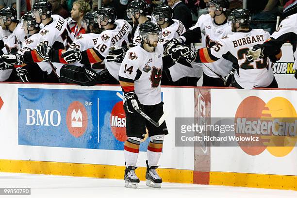 Jimmy Bubnick of the Calgary Hitmen celebrates his second-period goal against the Windsor Spitfires with team mates during the 2010 Mastercard...
