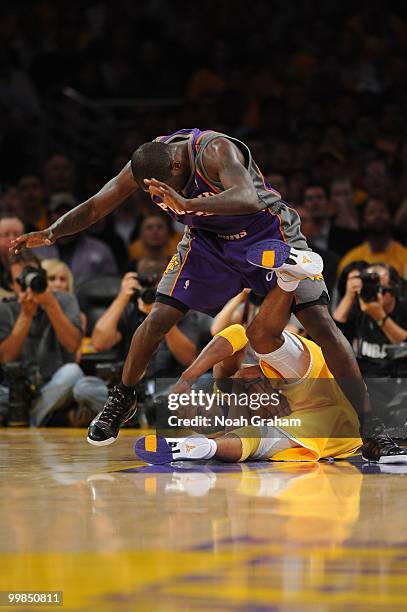 Kobe Bryant of the Los Angeles Lakers wrestles for the ball against Jason Richardson of the Phoenix Suns in Game One of the Western Conference Finals...