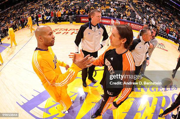 Derek Fisher of the Los Angeles Lakers and Steve Nash of the Phoenix Suns greet each other before Game One of the Western Conference Finals during...