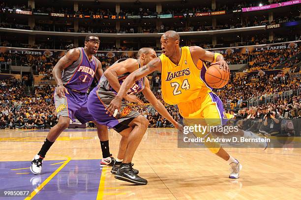 Kobe Bryant of the Los Angeles Lakers drives past Grant Hill of the Phoenix Suns in Game One of the Western Conference Finals during the 2010 NBA...