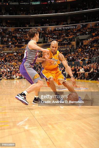 Derek Fisher of the Los Angeles Lakers dribbles against Steve Nash of the Phoenix Suns in Game One of the Western Conference Finals during the 2010...