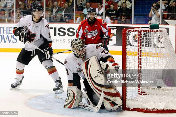 Martin Jones of the Calgary Hitmen gets down to stop the puck during the game against the Windsor Spitfires in the 2010 Mastercard Memorial Cup...