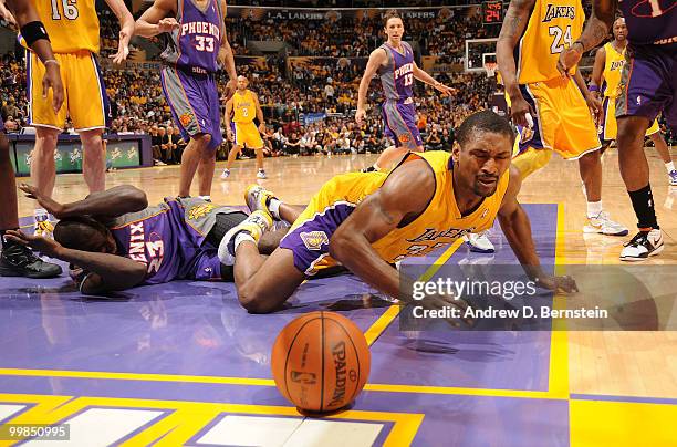 Ron Artest of the Los Angeles Lakers chases after a loose ball against Jason Richardson of the Phoenix Suns in Game One of the Western Conference...