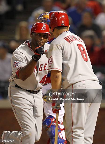 Torii Hunter of the Los Angeles Angels of Anaheim celebrates a solo homerun with Kendry Morales against the Texas Rangers on May 17, 2010 at Rangers...