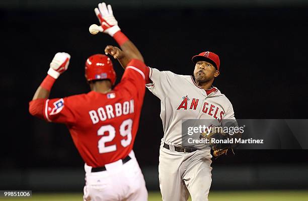 Second baseman Howie Kendrick of the Los Angeles Angels of Anaheim makes the out on the slide by Julio Borbon of the Texas Rangers on May 17, 2010 at...