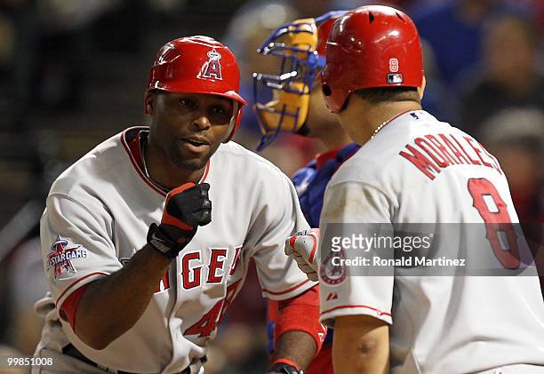 Torii Hunter of the Los Angeles Angels of Anaheim celebrates a solo homerun with Kendry Morales against the Texas Rangers on May 17, 2010 at Rangers...