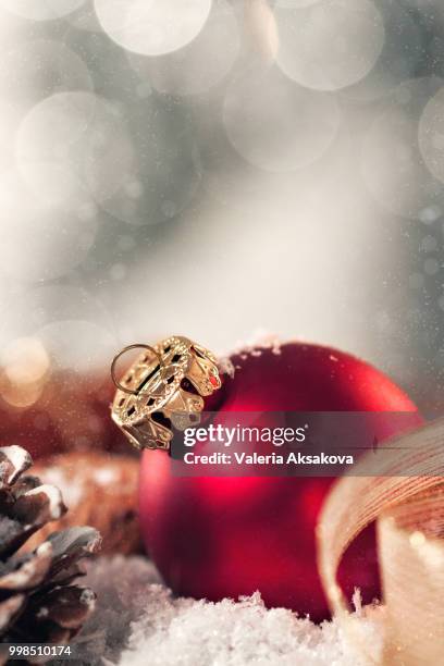 christmas ball with decoration with candles, fir cones, nuts, snow and ribbon, closeup, toned - carousel ball stock pictures, royalty-free photos & images