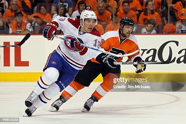 Mike Cammalleri of the Montreal Canadiens skates against Darroll Powe of the Philadelphia Flyers in Game 1 of the Eastern Conference Finals during...