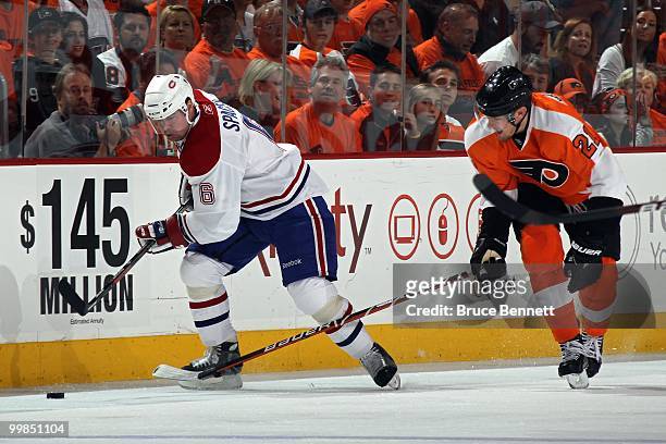 Jaroslav Spacek of the Montreal Canadiens skates against James van Riemsdyk of the Philadelphia Flyers in Game 1 of the Eastern Conference Finals...
