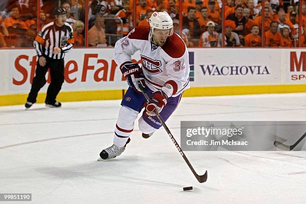 Travis Moen of the Montreal Canadiens handles the puck against the Philadelphia Flyers in Game 1 of the Eastern Conference Finals during the 2010 NHL...