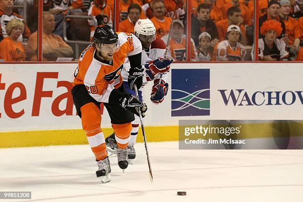 Subban of the Montreal Canadiens fights for the puck against Claude Giroux of the Philadelphia Flyers in Game 1 of the Eastern Conference Finals...