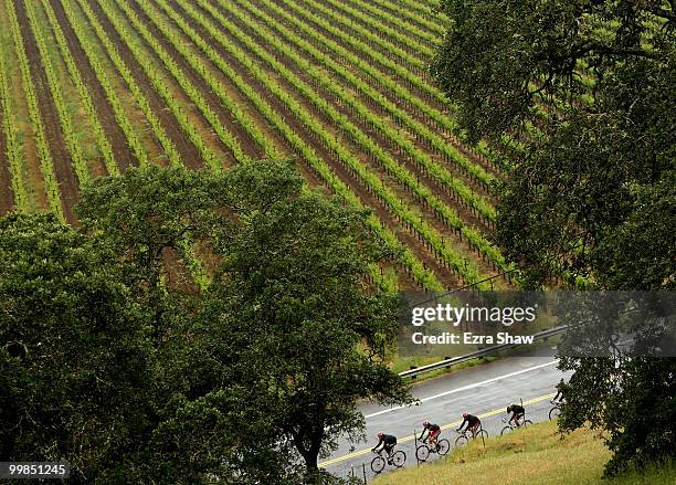 Riders for Team Radio Shack lead teammate Lance Armstrong of the USA past a vinyard during stage two of the Tour of California on May 17, 2010 in...