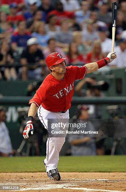 Michael Young of the Texas Rangers hits a sacrifice fly against the Los Angeles Angels of Anaheim on May 17, 2010 at Rangers Ballpark in Arlington,...