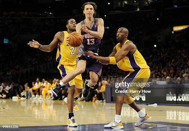 Guard Steve Nash of the Phoenix Suns looks to shoot the ball as guard Kobe Bryant of the Los Angeles Lakers defends in Game One of the Western...