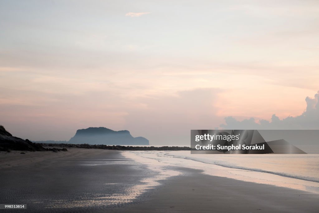 A foggy empty beach scene during early morning in Pranburi
