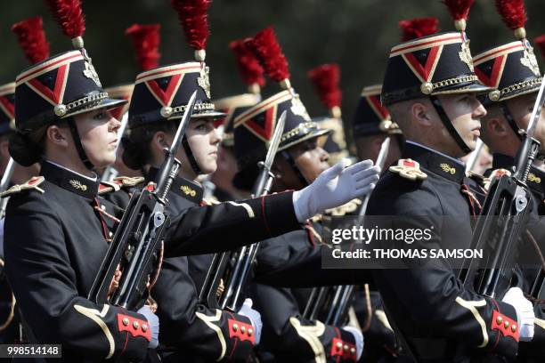 Members of the 1st and 2nd infantry regiment of French Republican Guard march during the annual Bastille Day military parade on the Champs-Elysees...