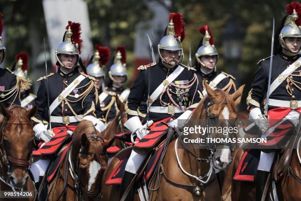 French Mounted Republican guards take part in the annual Bastille Day military parade on the Champs-Elysees avenue in Paris on July 14, 2018.