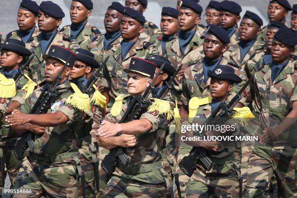 Soldiers of the Regiment du Service Militaire Adapte de Mayotte , march as they take part in the annual Bastille Day military parade on the...