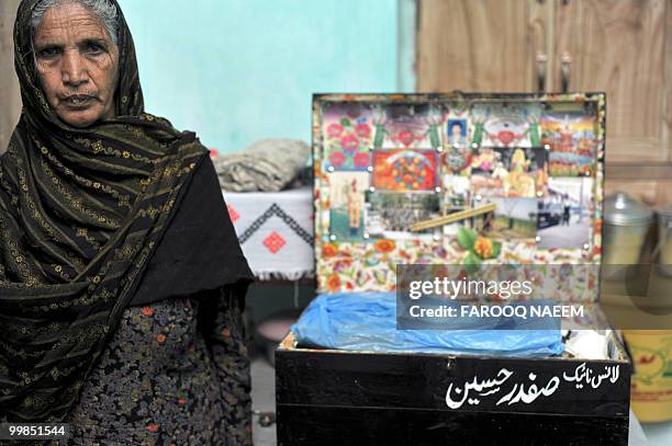 Pakistan-unrest-military,FEATURE by Khurram Shahzad In this picture taken on February 21 Munawar Noor, mother of a martyred Pakistani soldier sits...