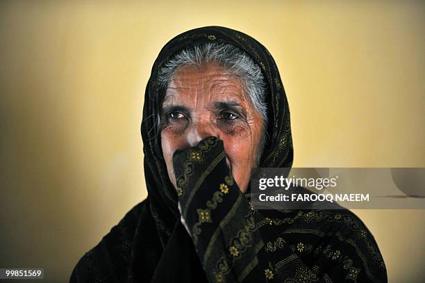 Pakistan-unrest-military,FEATURE by Khurram Shahzad In this picture taken on February 21 Munawar Noor, mother of a martyred Pakistani soldier weeps...
