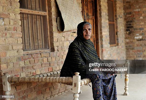 Pakistan-unrest-military,FEATURE by Khurram Shahzad In this picture taken on February 21 Munawar Noor, mother of a martyred Pakistani soldier sits on...