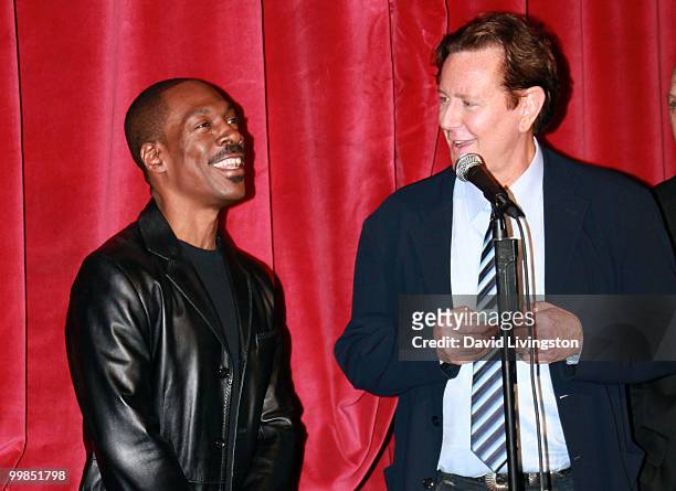 Actors Eddie Murphy and Judge Reinhold speak before the screening of "Beverly Hills Cop" during AFI & Walt Disney Pictures' "A Cinematic Celebration...