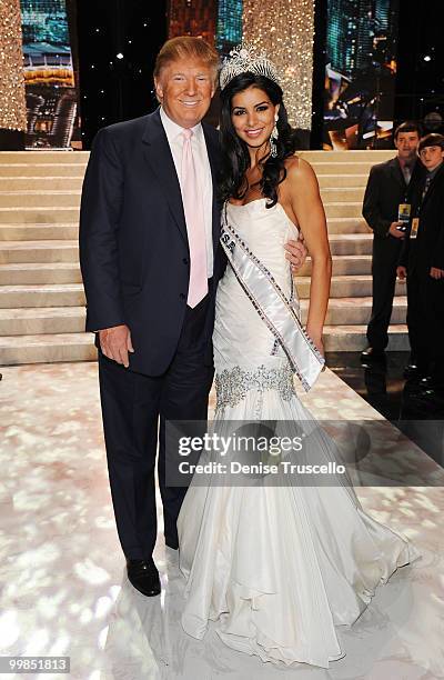 Donald J. Trump poses with Rima Fakih, winner of the Miss USA 2010 pageant, at Planet Hollywood Casino Resort on May 16, 2010 in Las Vegas, Nevada.