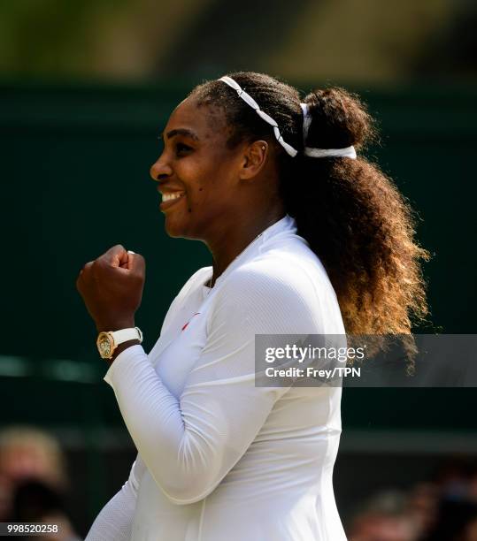 Serena Williams of the United States celebrates after beating Julia Georges of Germany in the ladies' semi finals at the All England Lawn Tennis and...