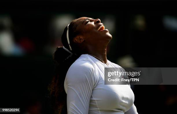 Serena Williams of the United States celebrates after beating Julia Georges of Germany in the ladies' semi finals at the All England Lawn Tennis and...